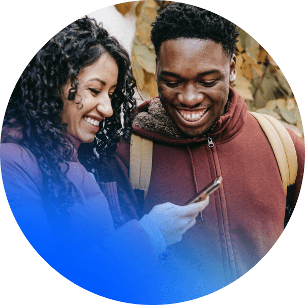 Two people looking at a mobile device