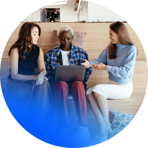 Group gathered around a laptop